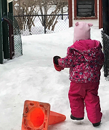 Child outside in snow Canada