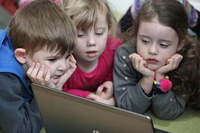 Children around laptop
