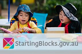 Two preschoolers playing outside with StartingBlocks.gov.au logo