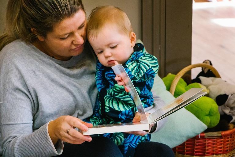 Educator reading to a toddler